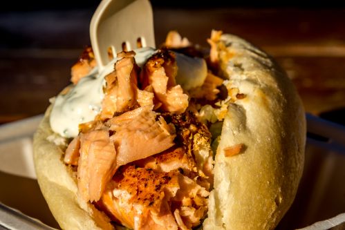 Served hot off the plank on a European-style bun